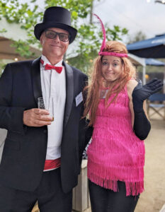 This is a picture of two people playing MURDER MYSTERY & FUN